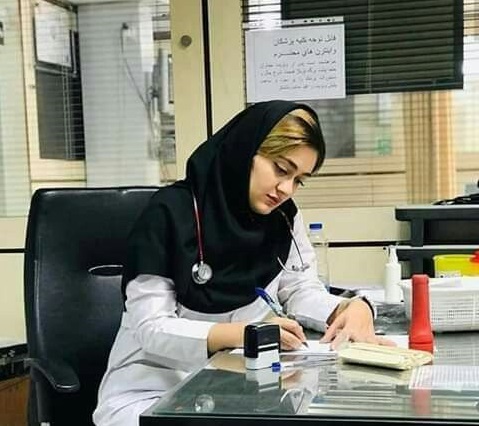 A female doctor with a patient at City Clinic, Wah Cantt